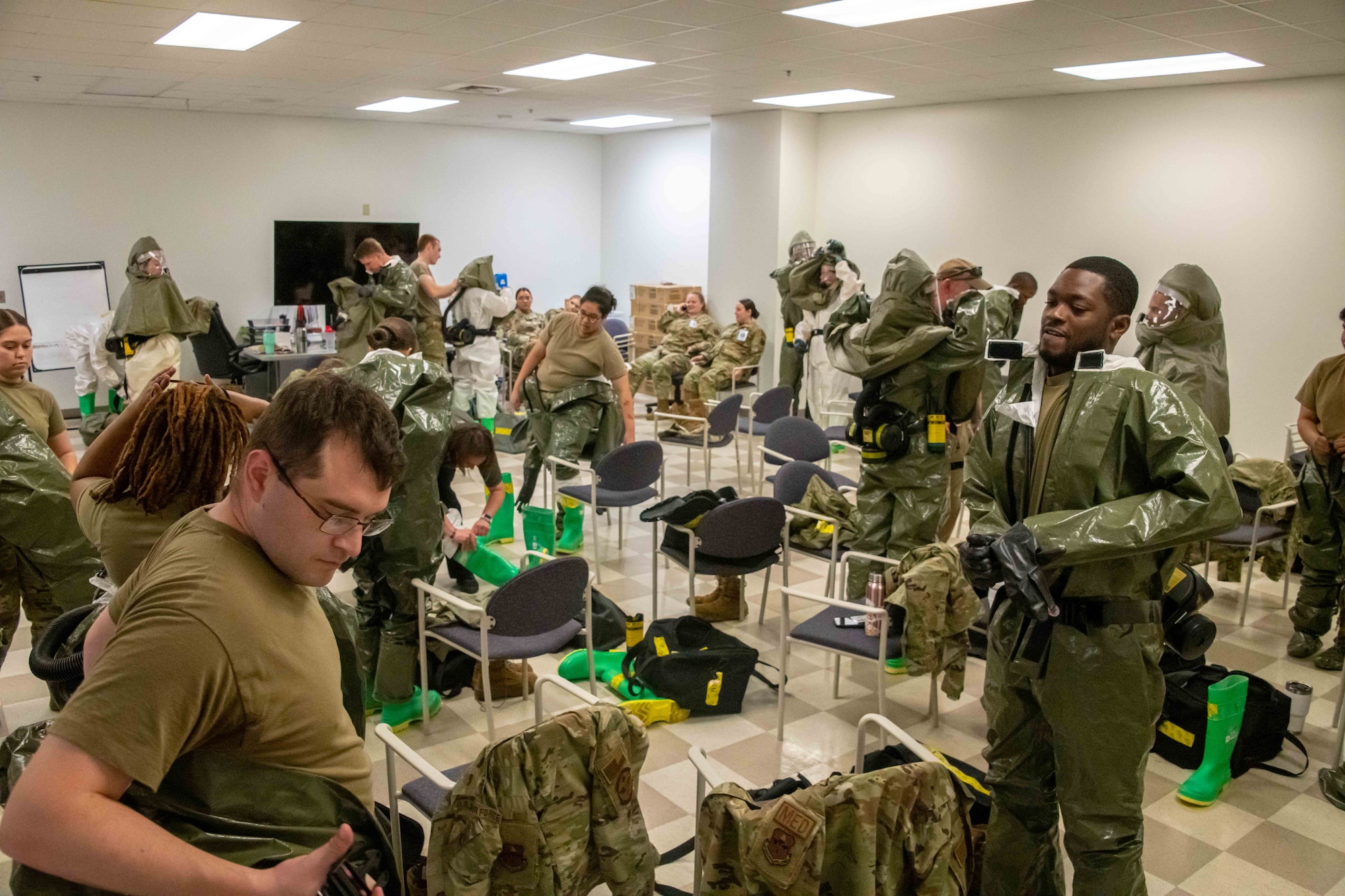 In-Place Patient Decontamination Team members suit up in preparation to perform decontamination procedures on patients that arrive for treatment. Ready Eagle I is a three-day event that builds on the previously conducted training in Ready Eagle II, focusing on gaps in capabilities and skill development.