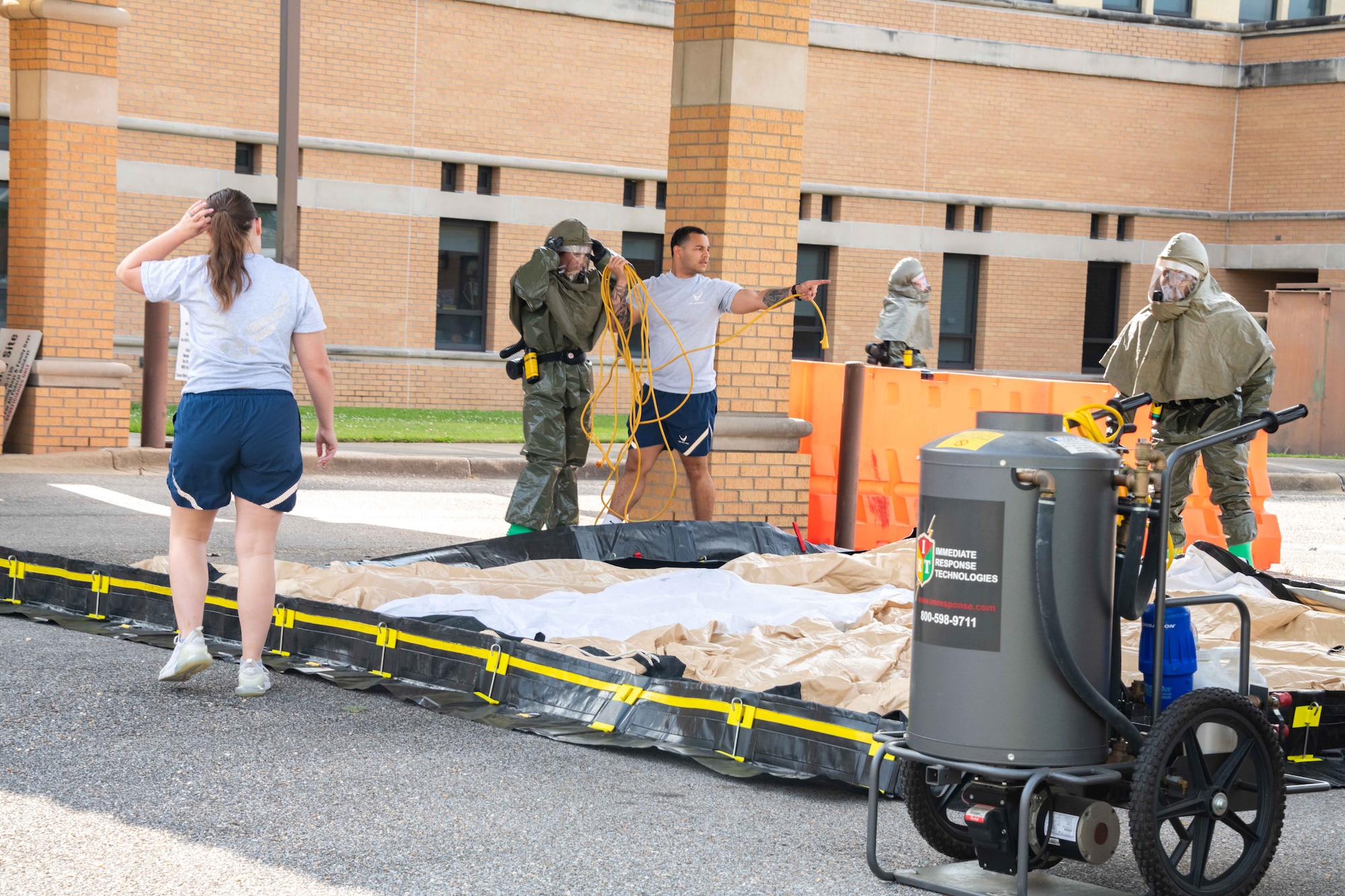 In-Place Patient Decontamination Team members begin set-up of shelter to perform patient decontamination for patients that arrive for treatment. The training aims to improve teamwork, response abilities, and Installation Medical All Hazards Response capability.