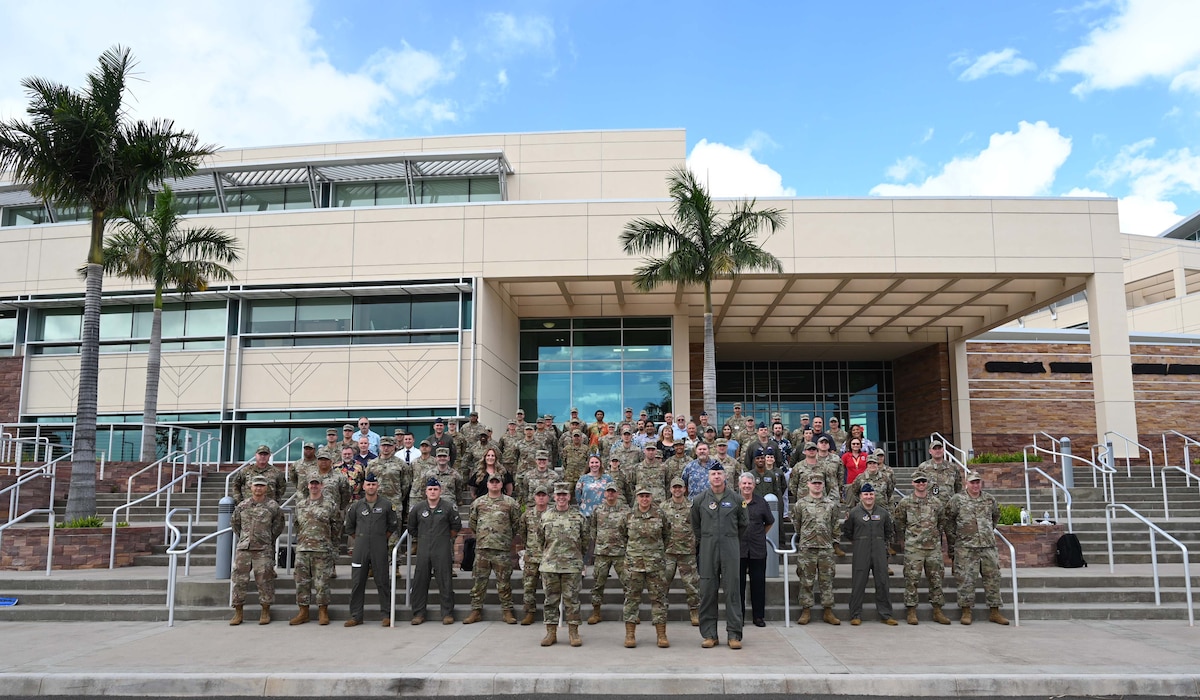 Photo of attendees at a symposium in Hawaii
