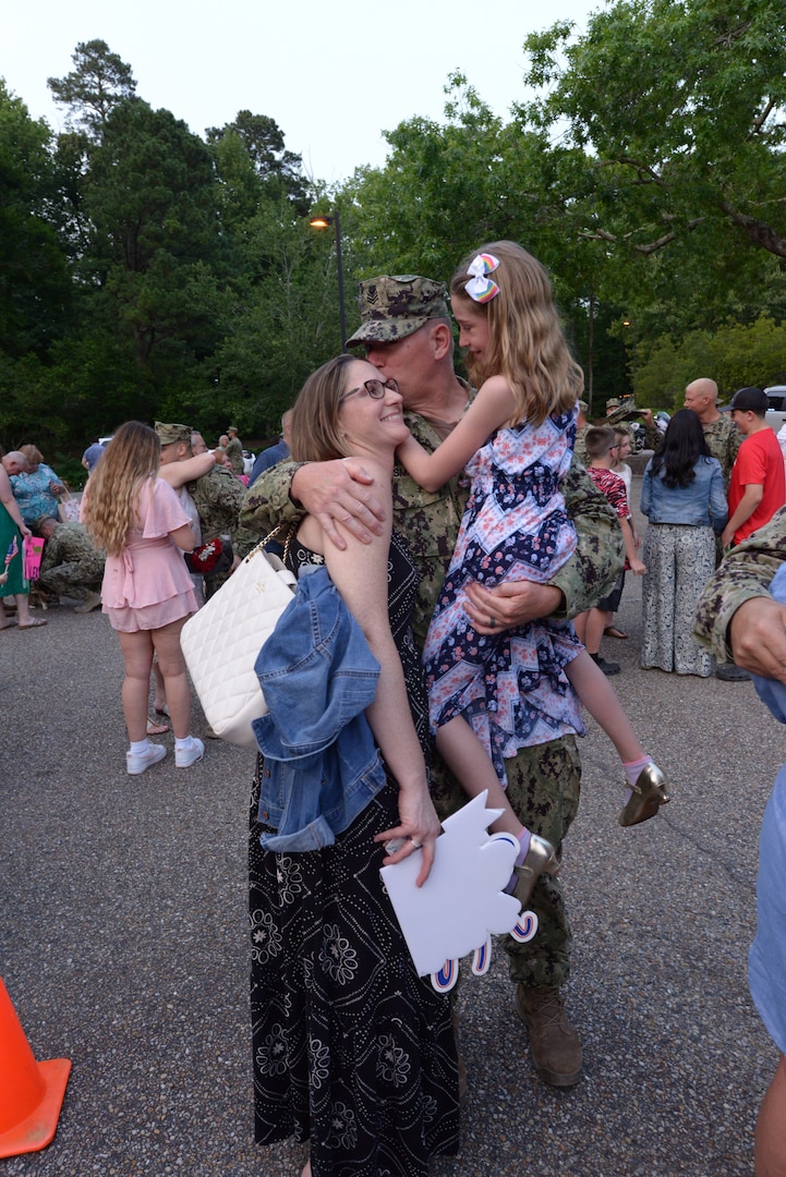 A member of Port Security Unit (PSU) 305 hugs and kisses loved ones during the PSU’s return home in Williamsburg, Va. after a nine-month deployment to Naval Station Guantanamo Bay, Cuba, June 15, 2023.

PSU 305, based in Fort Eustis, Va., was the first unit in 2002 to begin the Coast Guard’s mission with Joint Task Force- Guantanamo and is the last to complete it. (U.S. Coast Guard photo by Petty Officer 1st Class Valerie Higdon)