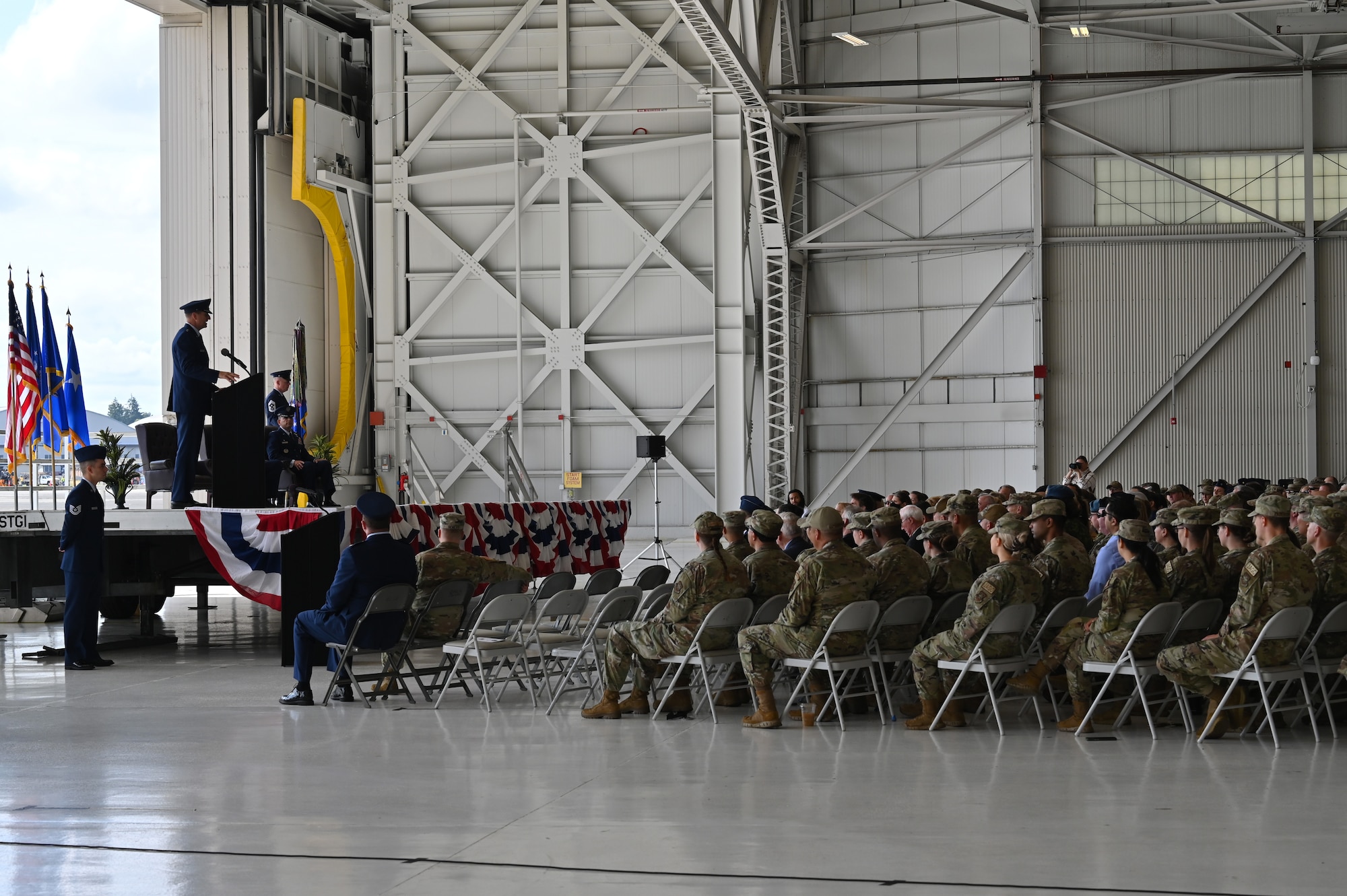 U.S. Air Force Maj. Gen. Corey Martin, 18th Air Force commander, gives remarks during the 62d Airlift Wing change of command ceremony at Joint Base Lewis-McChord, Washington, June 21, 2023. Col. Sergio Anaya, former 62d Operations Group commander, assumed command of more than 2,400 active-duty military and civilian personnel, along with 40 permanently assigned C-17A Globemaster III aircraft that support worldwide combat and humanitarian airlift and airdrop operations. (U.S. Air Force photo by Senior Airman Colleen Anthony)
