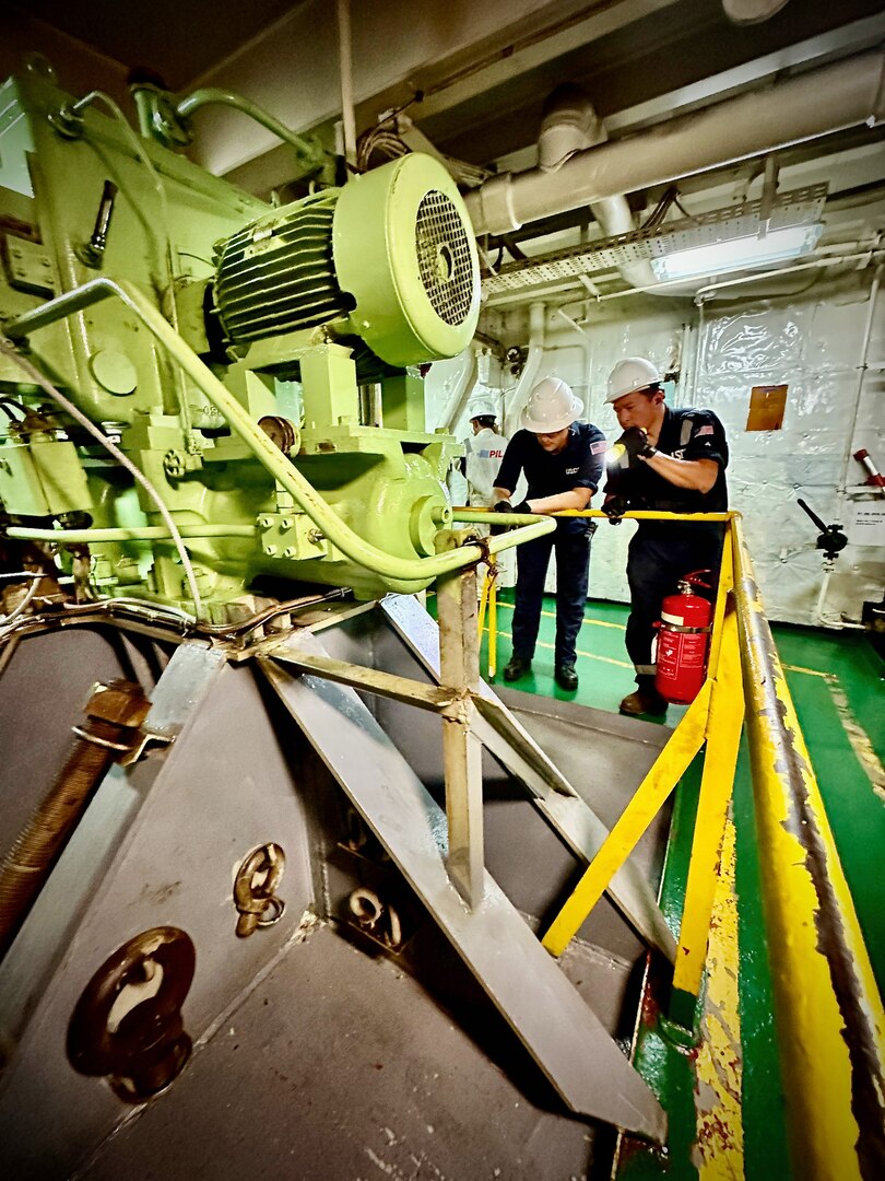 A U.S. Coast Guard Forces Micronesia Sector Guam team conducts a port state control examination on the 472-foot Singapore-flagged commercial cargo vessel Kota Raja in the Port of Guam on June 15, 2023.