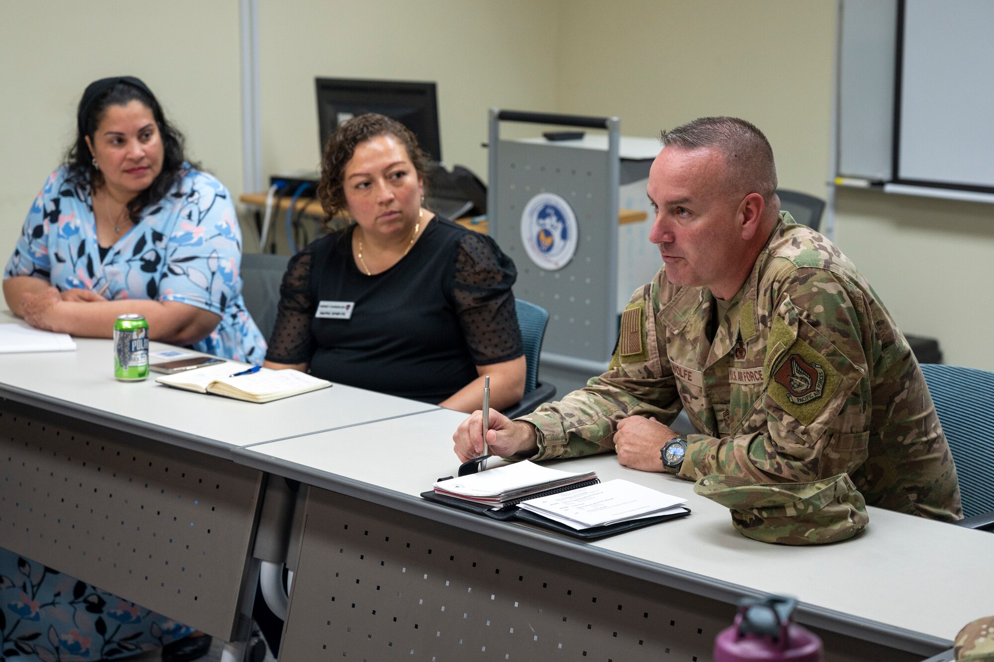 U.S. Air Force Chief Master Sgt. David Wolfe, right, Pacific Air Forces (PACAF) command chief, meets with a parent focus group at Osan Air Base, Republic of Korea, June 14, 2023. During the meeting, Wolfe spoke with parents of students in Department of Defense Education Activity schools about issues and obstacles they and their children face in the school system. (U.S. Air Force photo by Senior Airman Aaron Edwards)