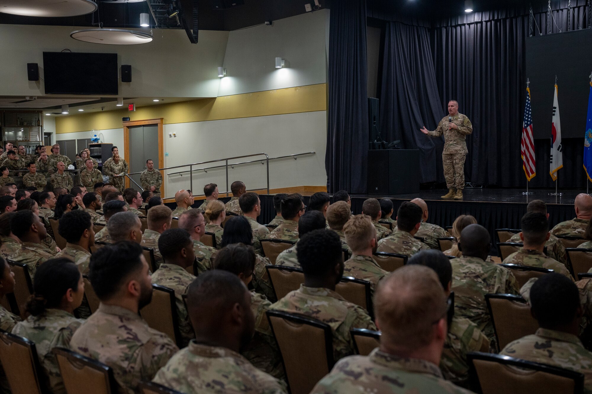 U.S. Air Force Chief Master Sgt. David Wolfe, Pacific Air Forces (PACAF) command chief, speaks during an all-call at Osan Air Base, Republic of Korea, June 15, 2023. Wolfe oversees approximately 48,000 personnel within PACAF and advises Gen. Ken Wilsbach, PACAF commander, on matters involving Airmen readiness, training, professional development and effective utilization of manning and resources within the pacific theater. (U.S. Air Force photo by Senior Airman Aaron Edwards)