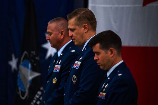  U.S. Space Force Col. Marc A. Brock, Space Delta 2 commander, left, Lt. Col. Matthew J. Lintker, outgoing 18th Space Defense Squadron (18 SDS) commander, middle, and Lt. Col. Jordan O.E. Mugg, incoming 18 SDS commander, stand during the beginning of the 18 SDS Change of Command ceremony at Vandenberg Space Force Base, Calif., June 21, 2023. (U.S. Space Force photo by Tech. Sgt. Luke Kitterman)