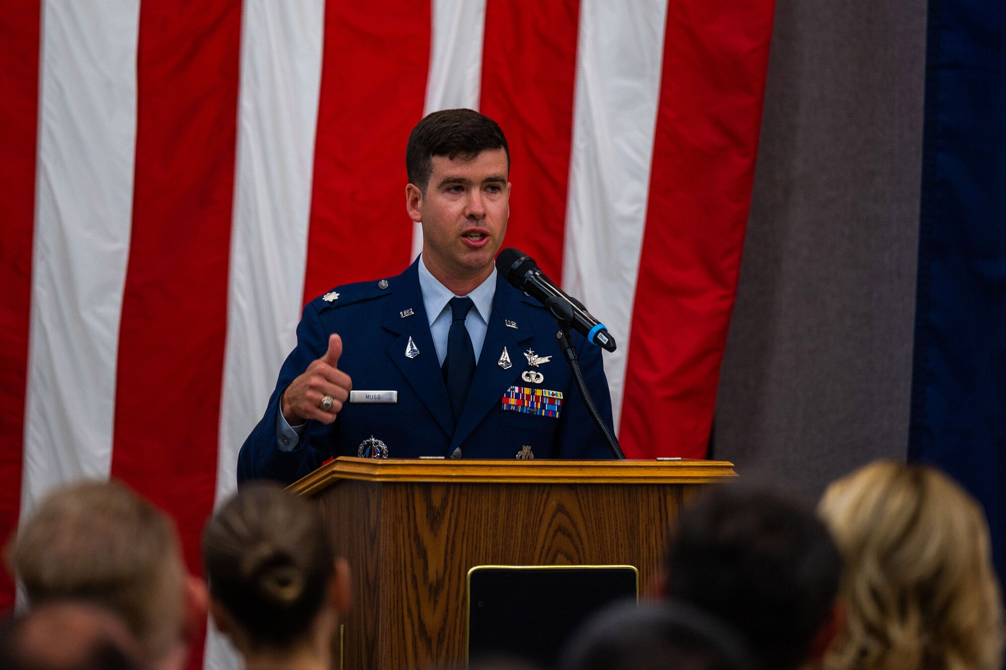U.S. Space Force Lt. Col. Jordan O.E. Mugg, the newly appointed 18th Space Defense Squadron (18 SDS) commander, speaks during the 18 SDS change of command ceremony at Vandenberg Space Force Base, Calif., June 21, 2023. 18 SDS maintains the most complete satellite catalog of Earth-orbiting artificial objects, currently tracking more than 44,400 objects including about 8,200 active spacecraft, which is available to the public on the website www.Space-Track.org. (U.S. Space Force photo by Tech. Sgt. Luke Kitterman)