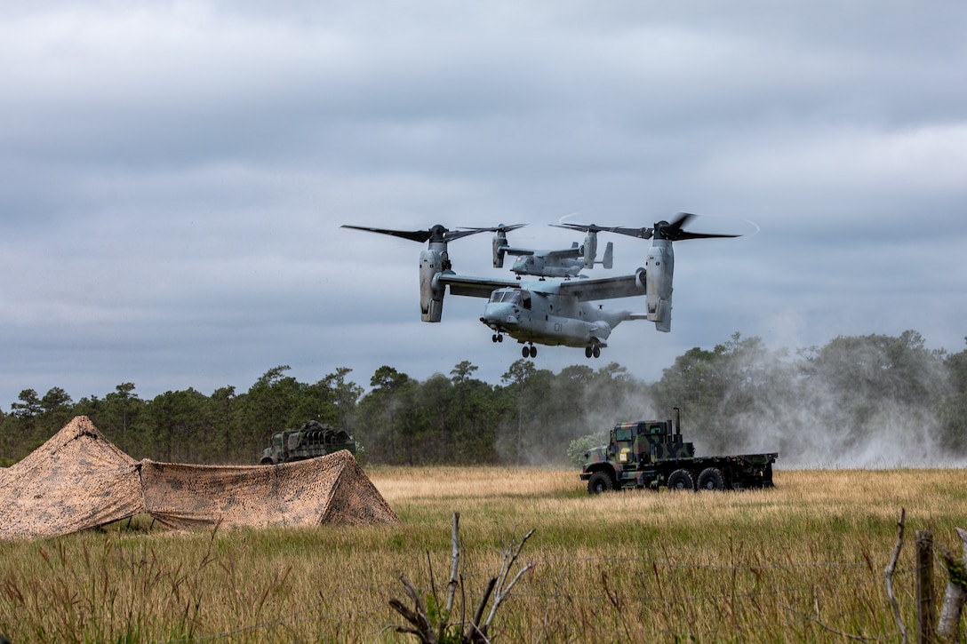 An MV-22 Osprey assigned to the 26th Marine Expeditionary Unit lands in a landing zone while conducting an amphibious assault raid during Composite Training Unit Exercise (C2X) at Marine Corps Base Camp Lejeune, North Carolina, June 2, 2023. The amphibious assault rehearsed the utilization of Marines to move from ship to shore and secure objectives for follow-on actions. Operations Training Group organized C2X as the last exercise in the pre-deployment training program for the Bataan Amphibious Ready Group. (U.S. Marine Corps photo by Cpl. Nayelly Nieves-Nieves)