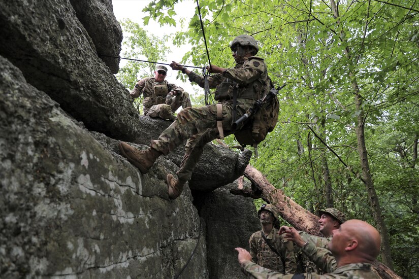 Approximately 25 Soldiers with 1st Squadron, 104th Cavalry Regiment, 2nd Infantry Brigade Combat team, 28th Infantry Division, Pennsylvania Army National Guard, conducted rappel training June 13 at a rock formation near Fort Indiantown Gap known as Boxcar Rocks. The Soldiers used mountain warfare skills to ascend the north face of the Boxcar Rocks safely with harnesses and ropes, then rappelled down the south face approximately 100 feet. (U.S. Army National Guard photo by Sgt. 1st Class Zane Craig)
