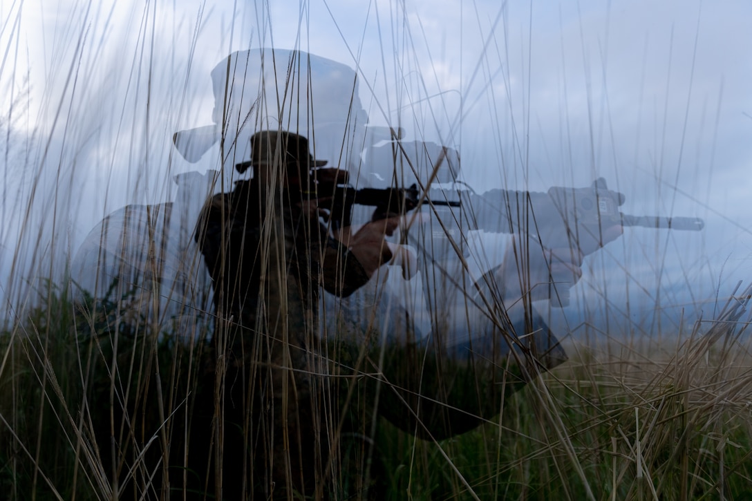 U.S. Marine Corps Sgt. Alec Allaire sights in using his M4 carbine during Exercise Shinka 23 at Combined Arms Training Center Camp Fuji, Japan, June 13, 2023. Shinka is the largest force-on-force training between the U.S. Marine Corps and the JGSDF that reaffirms the shared commitment to realistic training producing ready and adaptable forces capable of decentralized operations across a wide range of missions. Allair, a native of San Diego, is a Low Altitude Air Defense gunner with 2d LAAD Battalion, attached to 3d Battalion, 6th Marines, who are forward deployed in the Indo-Pacific under 4th Marines, 3d Marine Division as part of the Unit Deployment Program. (U.S. Marine Corps photo by Cpl. Noah Masog)