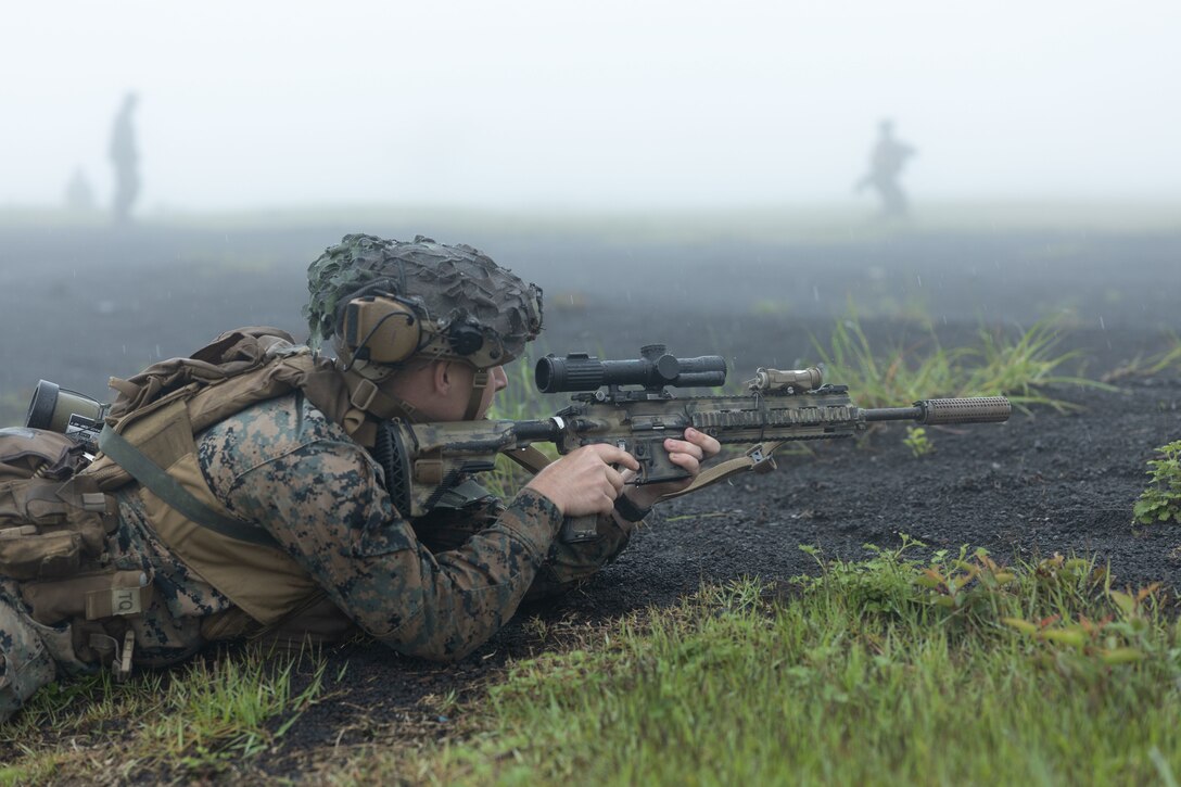 U.S. Marine Corps Lance Cpl. Logan Barret sights-in using an M27 Infantry Automatic Rifle during fire team maneuver training at Combined Arms Training Center Camp Fuji, Japan, June 12, 2023. Fireteam level training allows Marines to refine small-unit tactics, developing proficiency at the lowest level before executing combined arms-training. Barret, a native of Pensacola, Florida, is a rifleman with 3d Battalion, 6th Marines and is currently forward-deployed with 4th Marines, 3d Marine Division in the Indo-Pacific under the Unit Deployment Program. (U.S. Marine Corps photo by Lance Cpl. Evelyn Doherty)