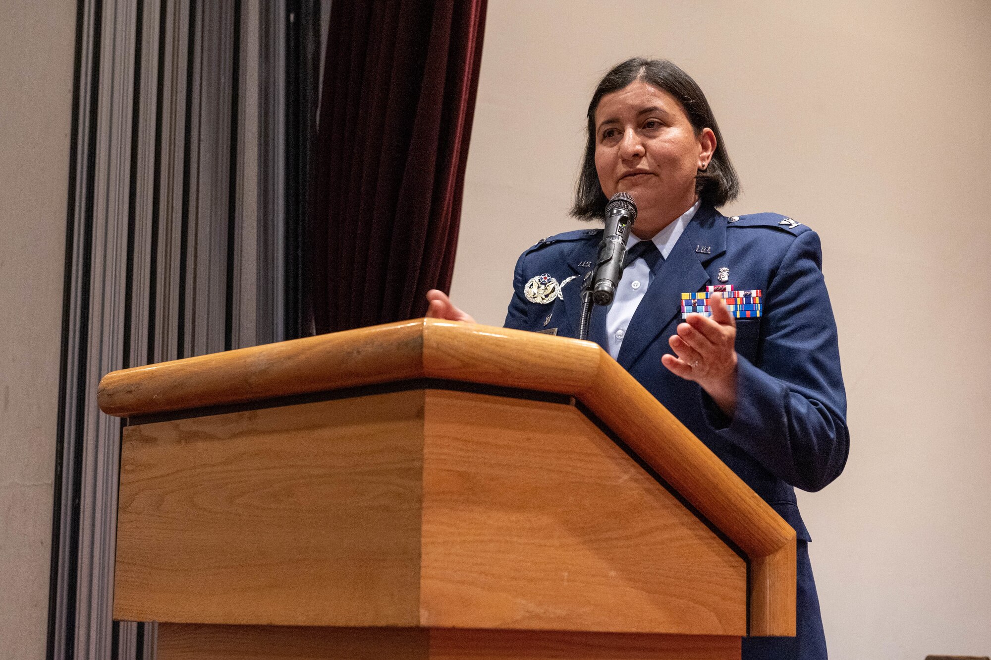 A service member delivers a speech during a change of command ceremony.