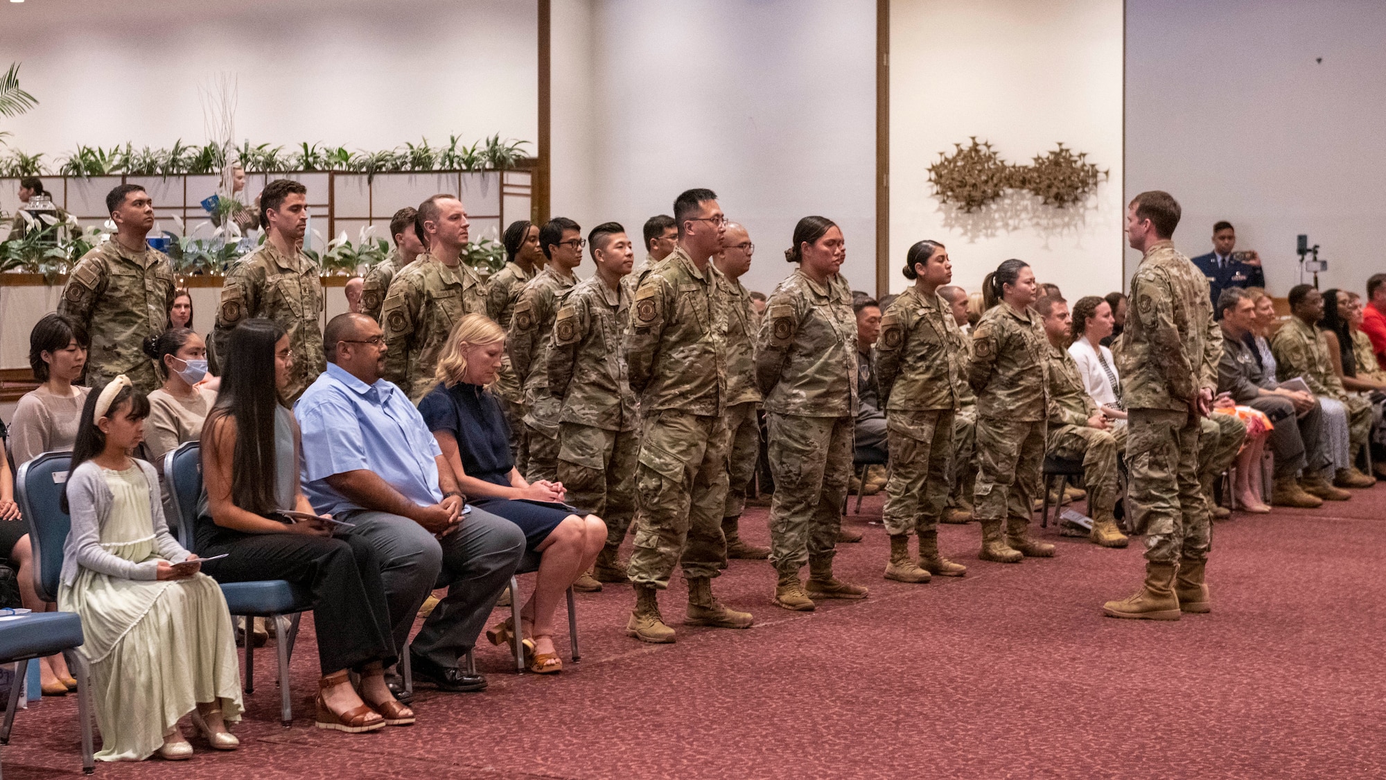 Members of the 374th Dental Squadron stand at parade rest during a change of command ceremony.