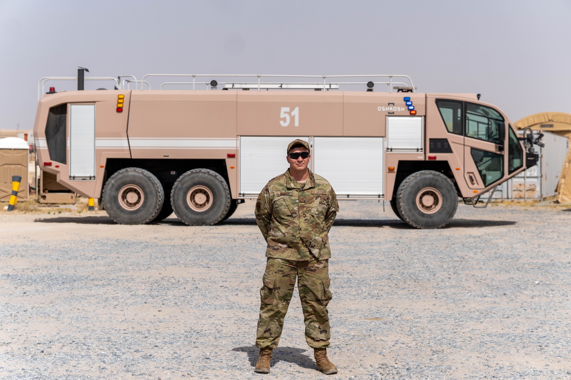 U.S. Air Force Technical Sgt. Matthew Dewitt, 386th Logistics Readiness Squadron NCOIC of fire truck and material handling, stands in front of an aircraft rescue and firefighting apparatus (ARFF) at Ali Al Salem Air Base, Kuwait. Dewitt secured the fire protection capabilities necessary to protect U.S. and partner nation forces by dedicating 252 hours on and off duty to repair the ARFF after it was rendered inoperable for 514 days.