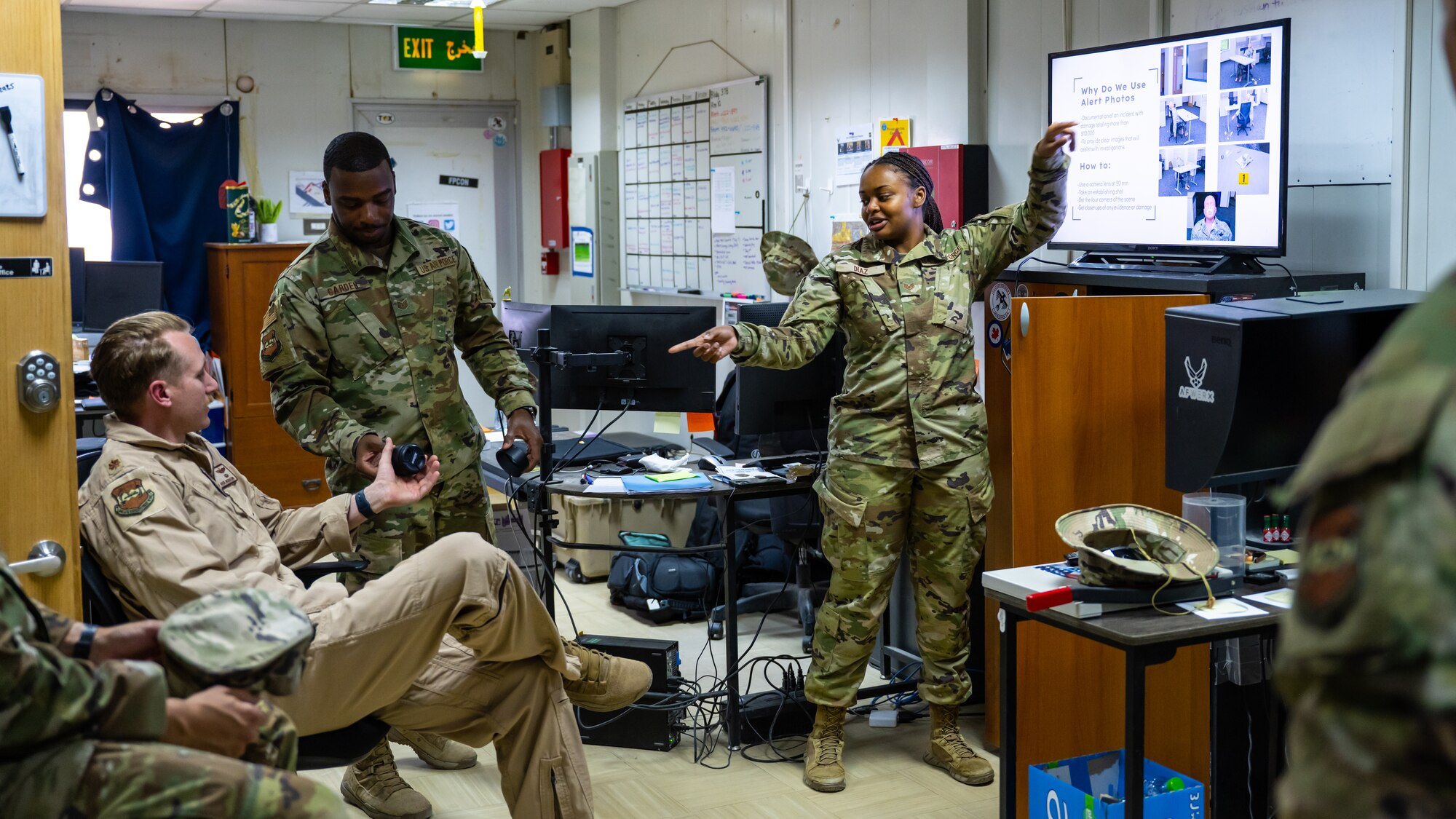 U.S. Air Force Staff Sgt. Breanna Diaz, 386th Air Expeditionary Wing public affairs specialist, teaches a class about alert photography procedures to Airmen from the 386th AEW safety office at Ali Al Salem Air Base, Kuwait, June 21, 2023. As Multi-Capable Airmen, the 386th AEW safety team is now equipped with the skills to photograph a variety of scenarios and provide the imagery to investigators. (U.S. Air Force photo by Staff Sgt. Kevin Long)