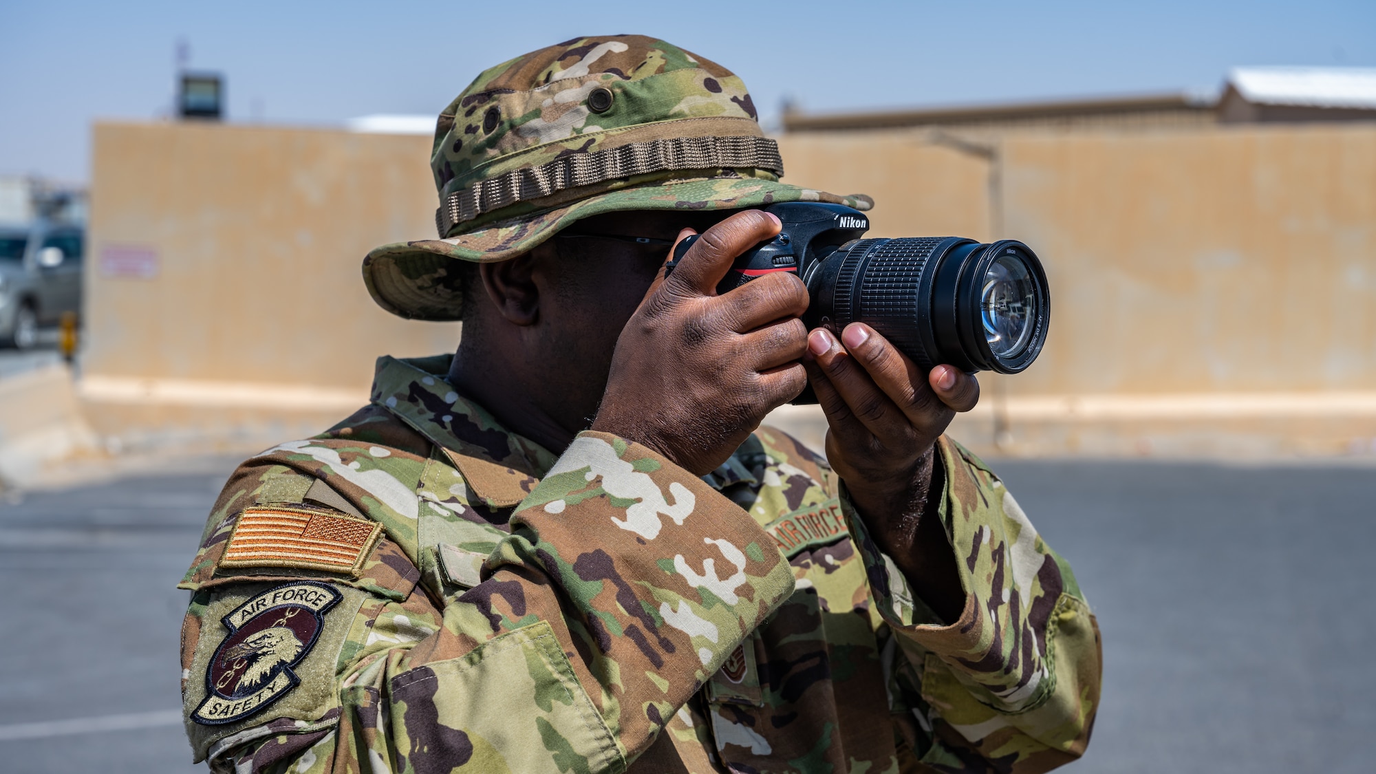 An Airman from the 386th Air Expeditionary Wing safety office practices his recently learned alert photography skills during alert photography training at Ali Al Salem Air Base, Kuwait, June 21, 2023. The 386th AEW public affairs office hosted this hands-on training to equip the safety team with the skills necessary to photograph a variety of scenarios and provide the imagery to assist with investigations.