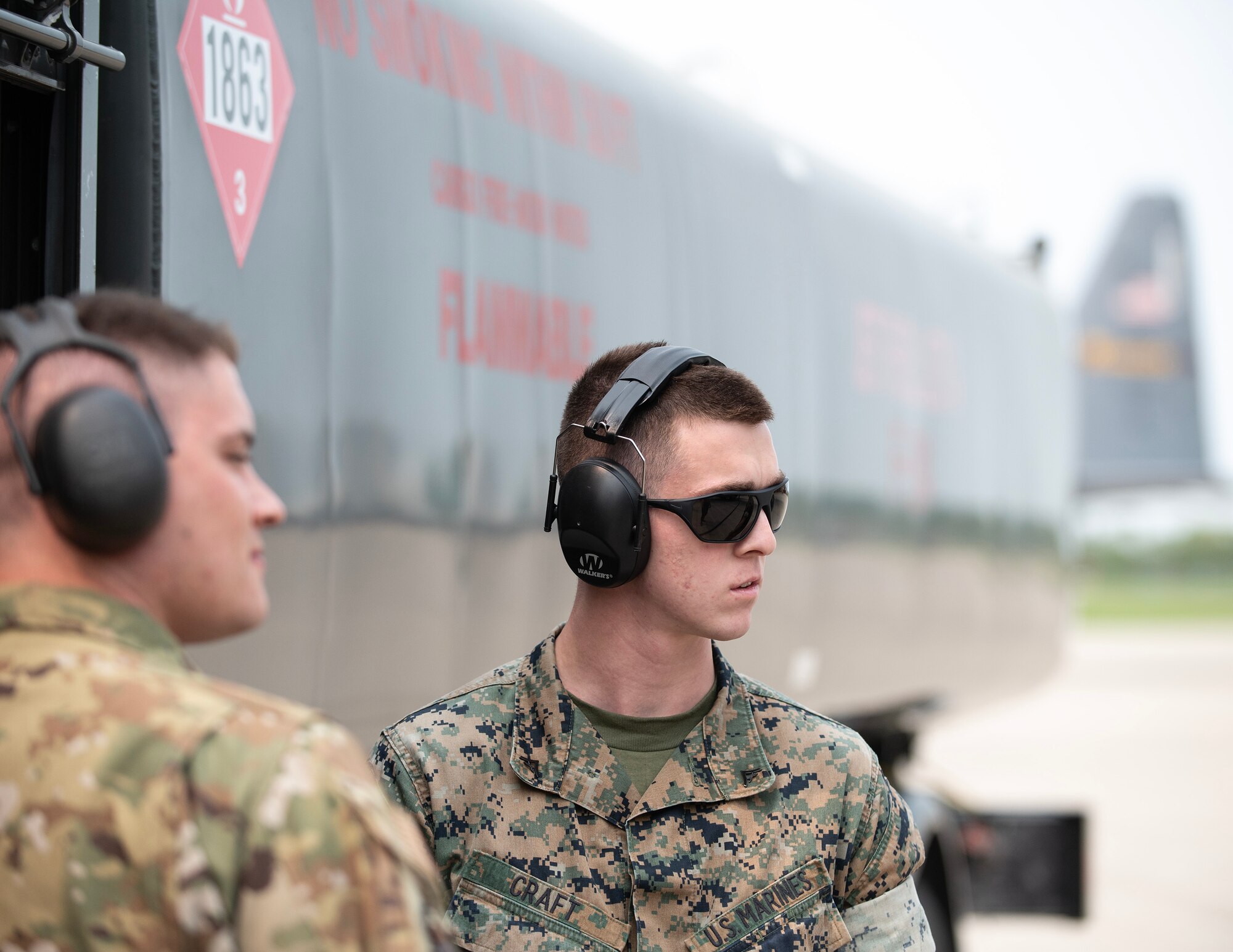 U.S. Marine Corps Lance Cpl. Matthew Craft, Marine Wing Support Squadron 471, controls the fuel flow while servicing the C-130 Hercules in St. Paul, Minn., May 17, 2023.