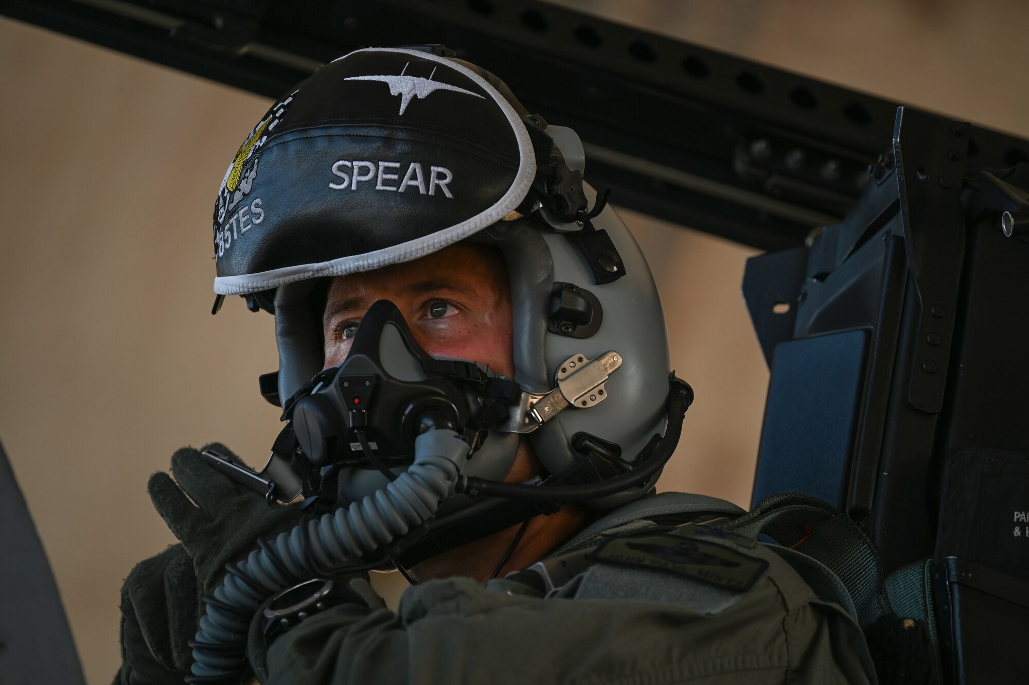 U.S. Air Force Col. John Paul F. Mintz, 850th Spectrum Warfare Group commander, puts on his face mask before he takes his final flight, at Eglin Air Force Base, Fla., June 20, 2023. Mintz is a command pilot with more than 1,700 flying hours in the F-15A-EX, F-16, T-38, and T-37. (U.S. Air Force photo by Staff Sgt. Ericka A. Woolever)