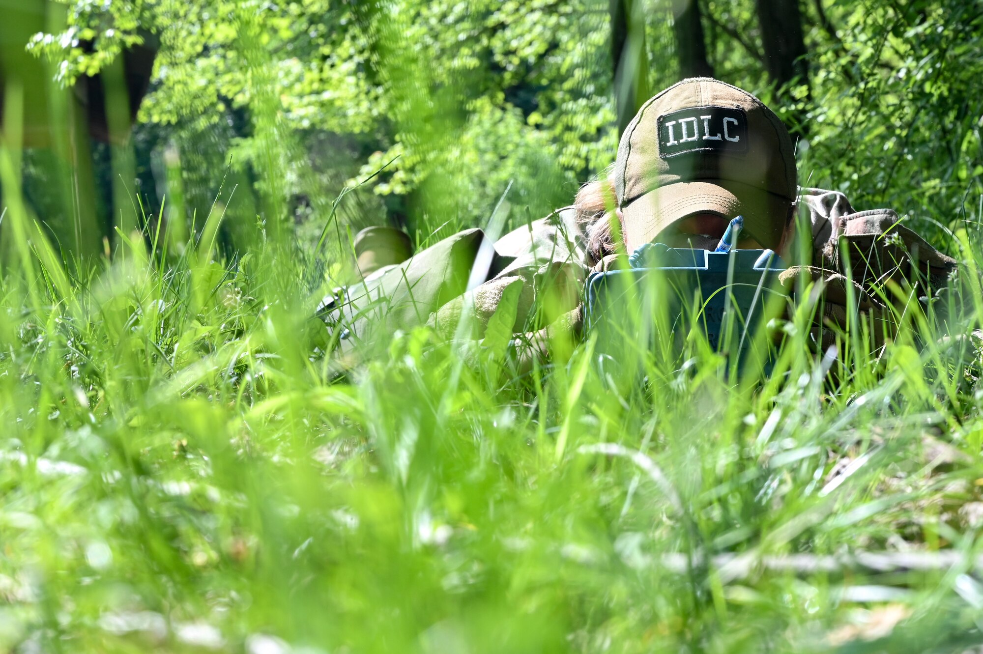 Senior Airman Brianna Clay, an Integrated Defense Leadership Course cadre member assigned to the 349th Security Forces Squadron, Travis Air Force Base, California, prepares a practice claymore during a training exercise on May 31, 2023, at Camp James A. Garfield Joint Military Training Center, Ohio.