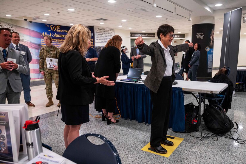 A person stands on an object during a technology demonstration.