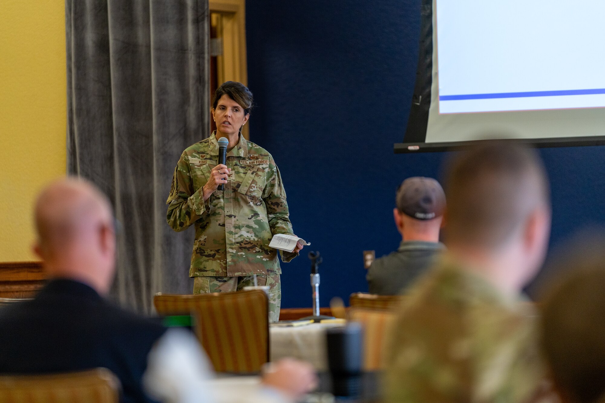 U.S. Air Force Col. Laura King, 81st Training Group commander, speaks at the Cyber Training Summit at Keesler Air Force Base, Mississippi, June 5, 2023.