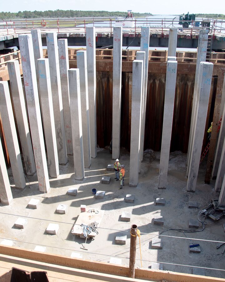 Crewmembers assess and monitor pile cutting at Onslow Beach Bridge, Marine Corps Base Camp Lejeune.
Crews working at the bridge replacement site have been working 23 ft below the water line while staying nice and dry with the help of a millennia old technology: the cofferdam.