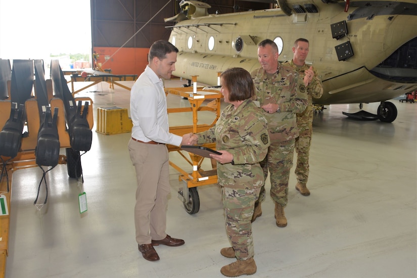 Brig. Gen. Laura McHugh, right, deputy adjutant general-Army, Pennsylvania National Guard, congratulates Joshua Dietrich after presenting him the award for Army National Guard 2022 Airfield Manager of the Year June 21, 2023, at Fort Indiantown Gap, Pa. (Pennsylvania National Guard photo by Brad Rhen)