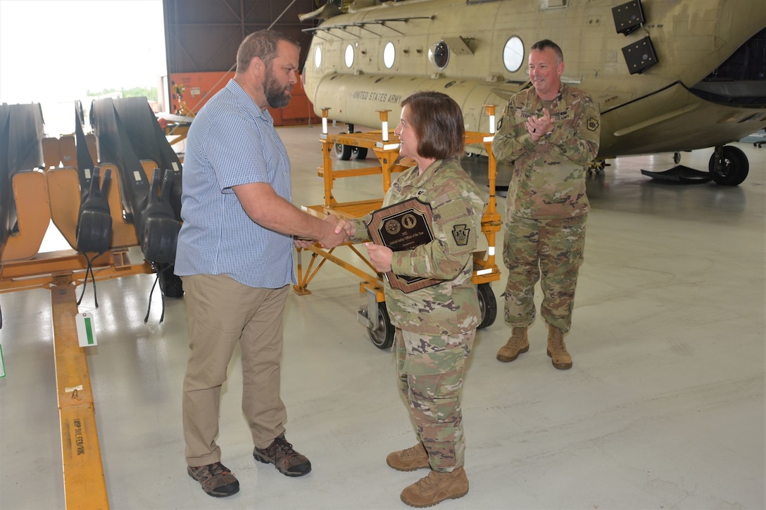 Brig. Gen. Laura McHugh, right, deputy adjutant general-Army, Pennsylvania National Guard, congratulates Joseph Sandbakken after presenting him the award for Army National Guard 2022 Safety Officer of the Year June 21, 2023, at Fort Indiantown Gap, Pa. (Pennsylvania National Guard photo by Brad Rhen)