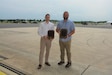 Joshua Dietrich, left, airfield manager at Muir Army Airfield, and Joseph Sandbakken, safety officer at Muir Army Airfield, pose with their awards June 21, 2023, at Muir Army Airfield at Fort Indiantown Gap, Pa. Dietric was named Army National Guard 2022 Airfield Manager of the Year, and Sandbakken was named Army National Guard 2022 Safety Officer of the Year. (Pennsylvania National Guard photo by Brad Rhen)