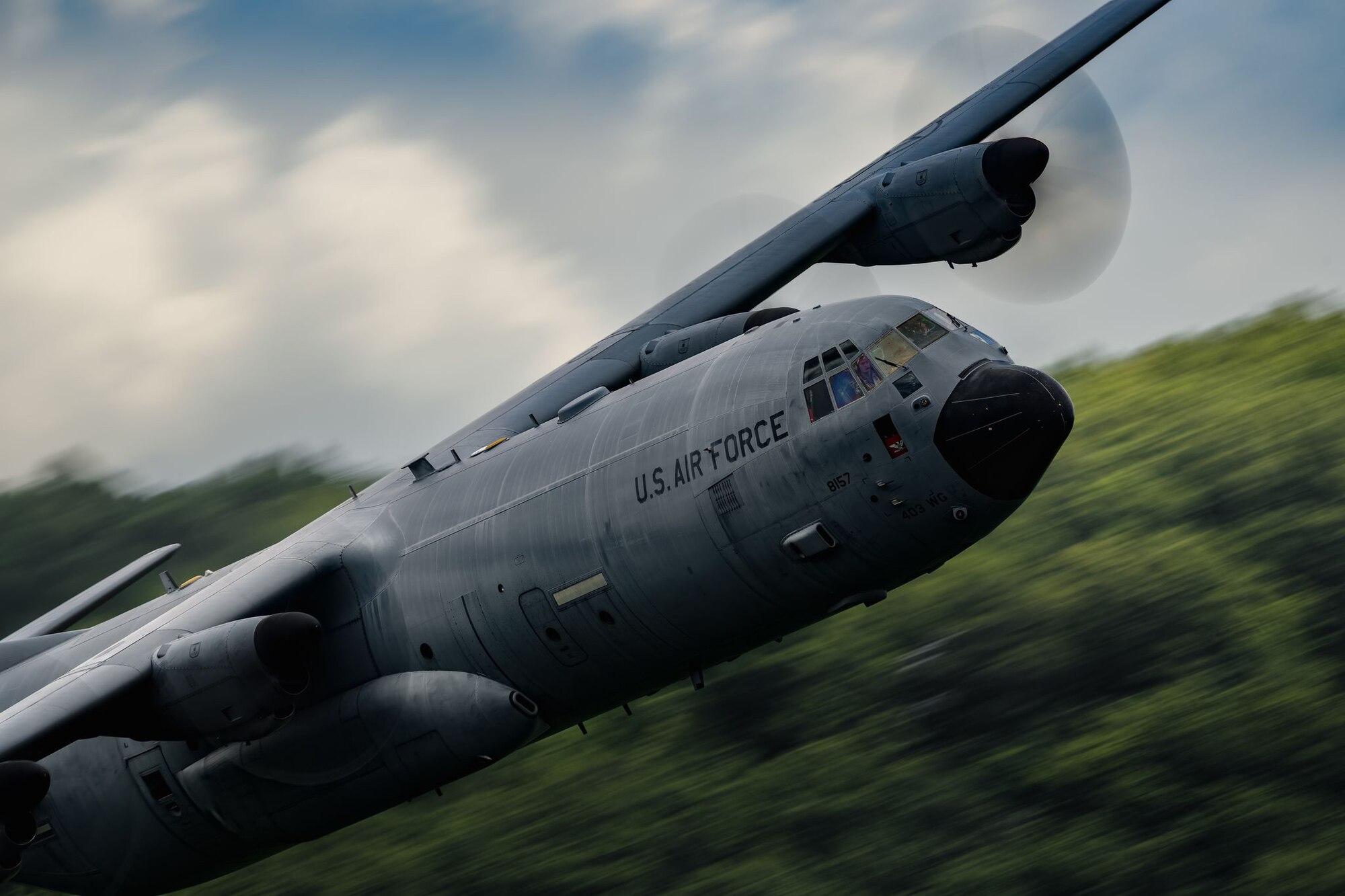 C-130J Super Hercules flying through the mountains