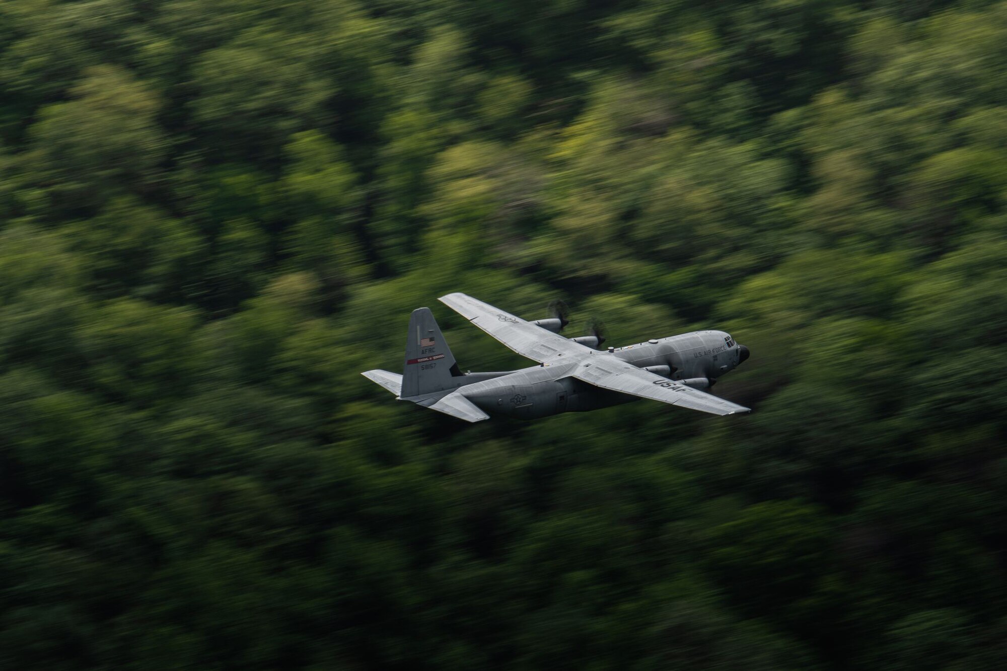 C-130J Super Hercules flying through the mountains