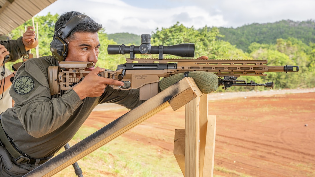A Fuerzas Comando 23' competitor takes a shot during a sniper event, June 17, 2023 in Sierra Prieta, Santo Domingo.