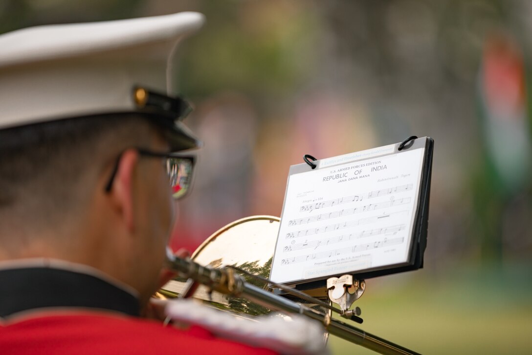 A Marine Band trombone player reads sheet music for the national anthem of the Republic of India on June 20, 2023 during a rehearsal for the State Arrival of Indian Prime Minister Modi.