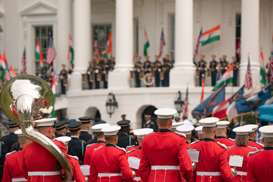 The Marine Band stands at attention on the South Lawn of the White House on June 20, 2023 during a rehearsal for the State Arrival of Indian Prime Minister Modi.