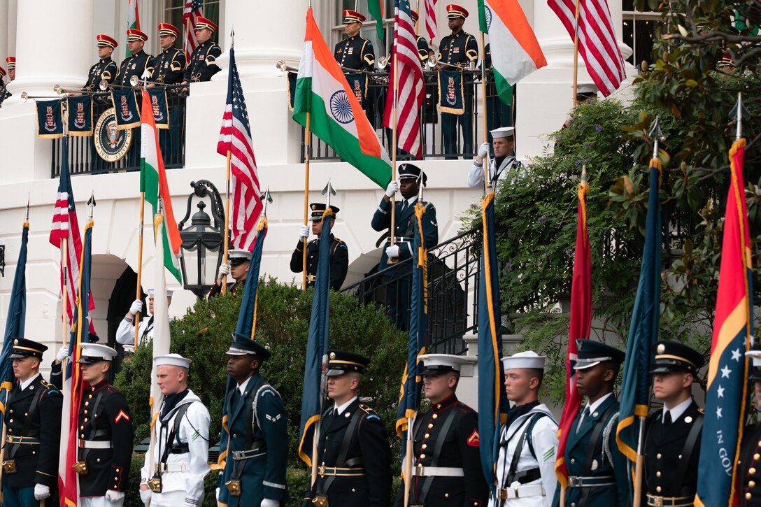 Ceremonial troops from the U.S. Military hold flags and line the driveway and steps of the White House on June 20, 2023 during a rehearsal for the State Arrival of Indian Prime Minister Modi.