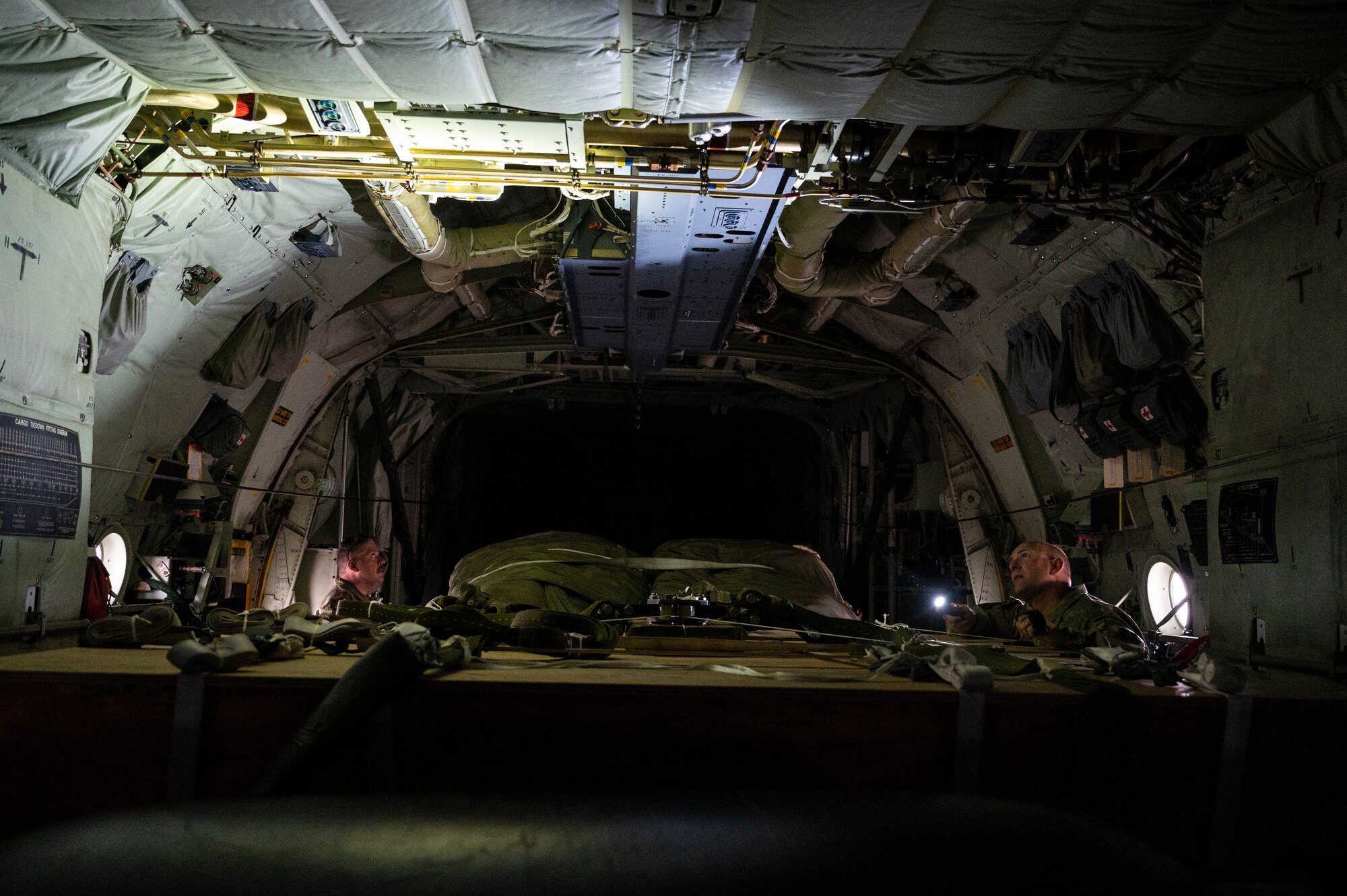 Men look at inside of plane
