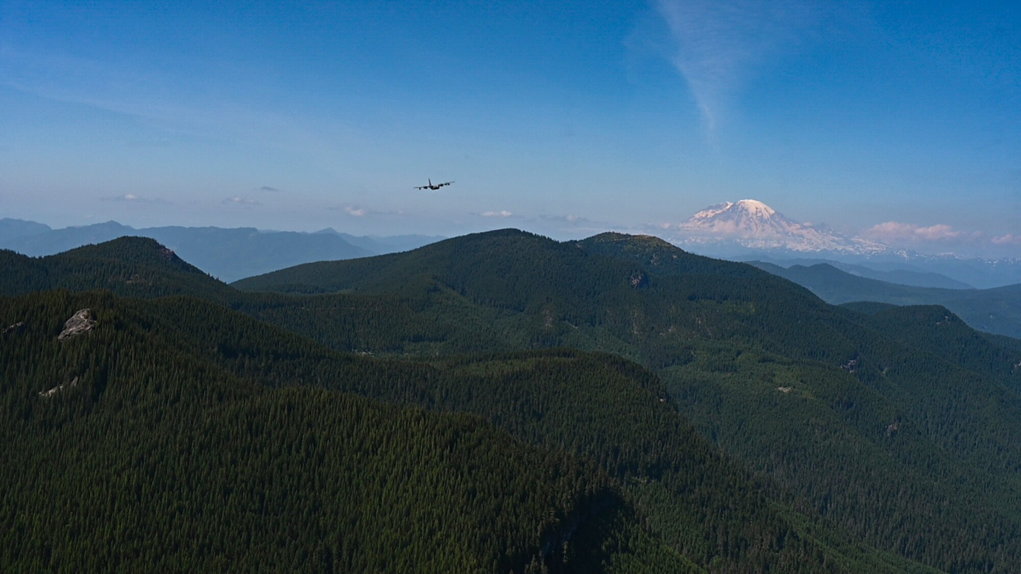 Plane flies over mountains
