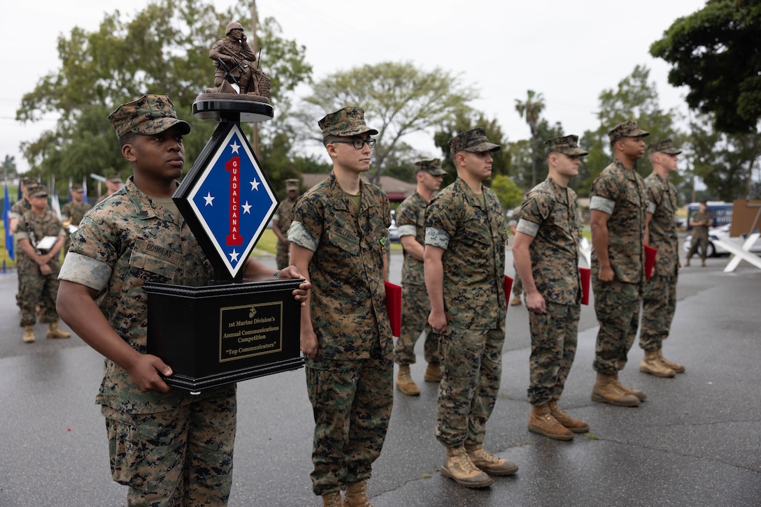 U.S. Marines with Headquarters Battery, 11th Marine Regiment, 1st Marine Division, stand at attention after being recognized for winning the 1st MARDIV communication competition during the division’s morning colors ceremony at Marine Corps Base Camp Pendleton, California, June 2, 2023. The division holds the ceremony every quarter to recognize Marines and Sailors for outstanding performance.