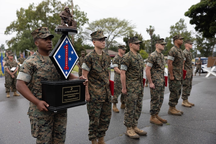 U.S. Marines with Headquarters Battery, 11th Marine Regiment, 1st Marine Division, stand at attention after being recognized for winning the 1st MARDIV communication competition during the division’s morning colors ceremony at Marine Corps Base Camp Pendleton, California, June 2, 2023. The division holds the ceremony every quarter to recognize Marines and Sailors for outstanding performance.