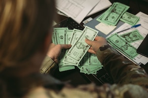 An Airmen from the 139th Comptroller Flight participates in a large readiness exercise at Rosecrans Air National Guard Base, St. Joseph, Mo., June 9, 2023. The finance office handled different financial scenarios to prepare them during the LRE. (U.S. Air National Guard photo by Staff Sgt. Andrew Rivera)
