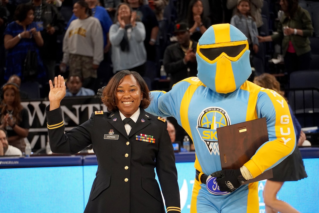 Chicago Sky, Women's National Basketball Association team, honors Maj. Tiesha Stephens, of the 85th U.S. Army Reserve Support Command, on court during the ‘Military Moment of the Game’ service recognition at a Juneteenth observance home game versus the Indiana Fever at Wintrust Arena, June 15, 2023, in Chicago.