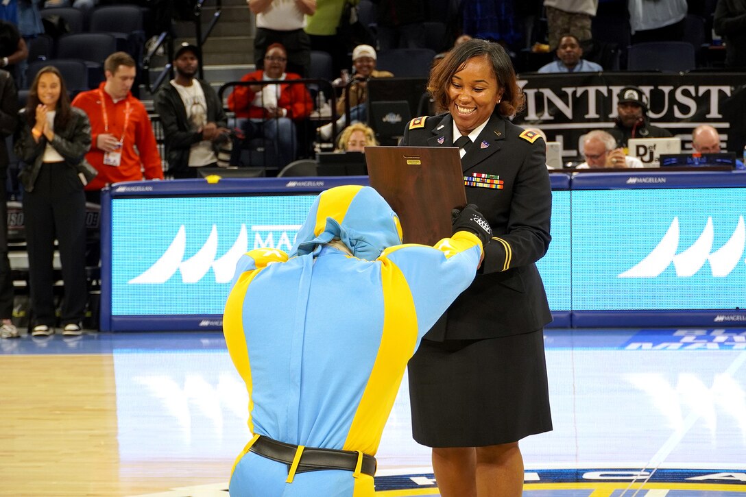Chicago Sky, Women's National Basketball Association team, honors Maj. Tiesha Stephens, of the 85th U.S. Army Reserve Support Command, on court during the ‘Military Moment of the Game’ service recognition at a Juneteenth observance home game versus the Indiana Fever at Wintrust Arena, June 15, 2023, in Chicago.
