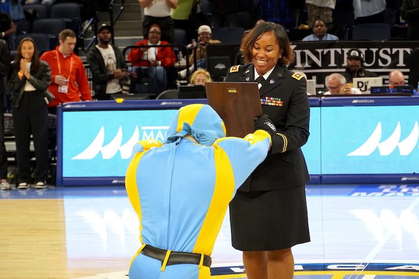 Chicago Sky, Women's National Basketball Association team, honors Maj. Tiesha Stephens, of the 85th U.S. Army Reserve Support Command, on court during the ‘Military Moment of the Game’ service recognition at a Juneteenth observance home game versus the Indiana Fever at Wintrust Arena, June 15, 2023, in Chicago.