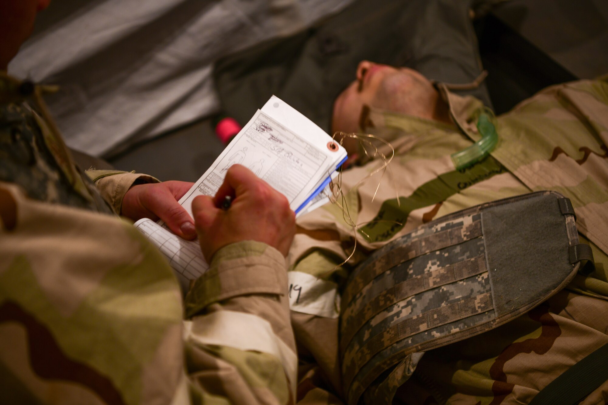 U.S. Air Force 9th Reconnaissance Wing Airmen lies down injured, June 16, 2023 at Beale Air Force Base, California.