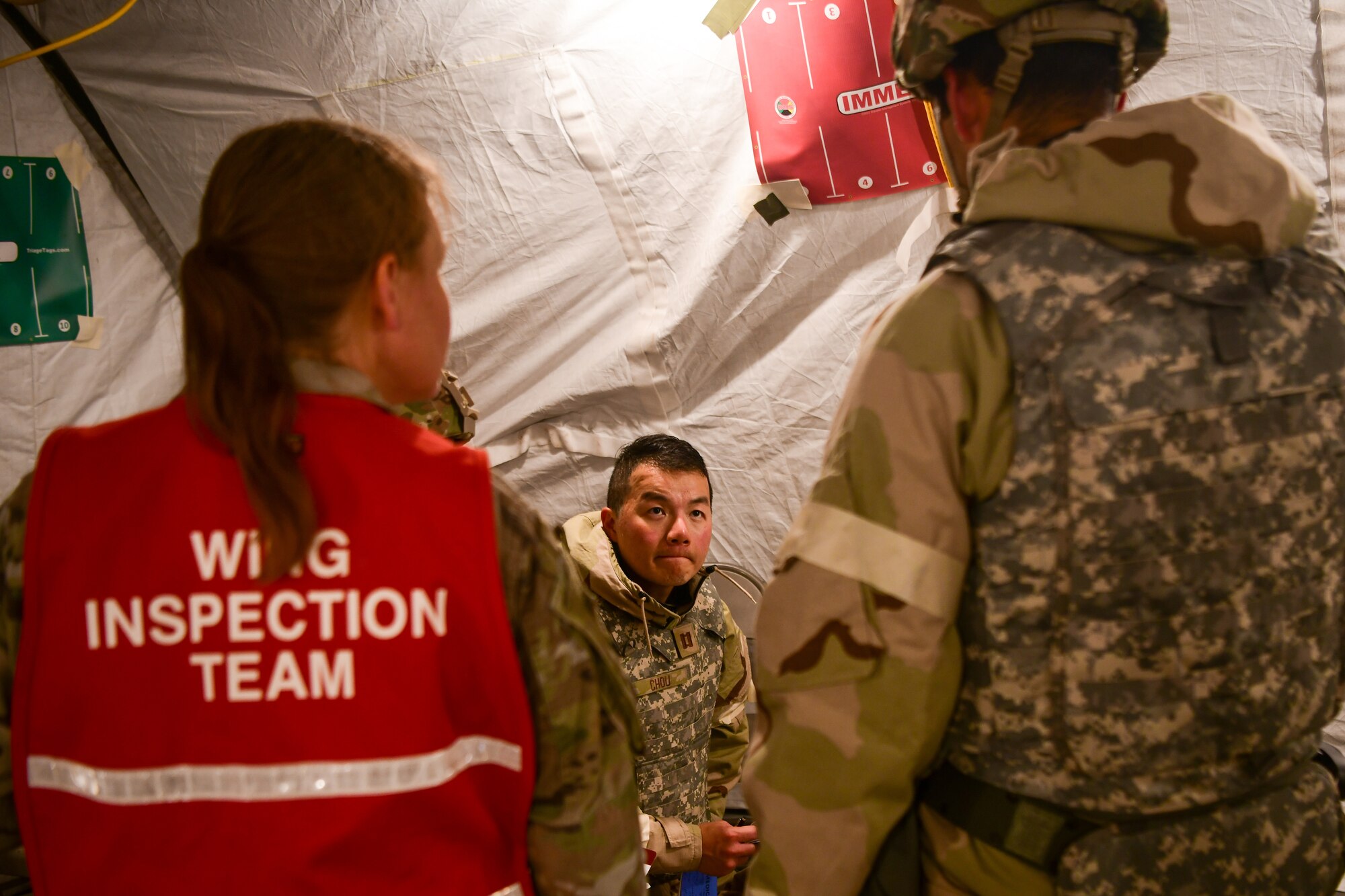 U.S. Air Force Capt. David Chou, 9th Medical Group physician, conducts duties while being inspected by a wing inspection team member, June 16, 2023 at Beale Air Force Base, California.