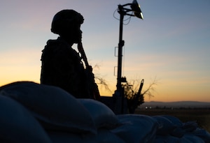 U.S. Air Force Airman 1st Class Aaron Roberts, 9th Communication Squadron client system technician, stands guard at a defensive fighting position during Exercise DRAGON FANG, June 16, 2023, at Beale Air Force Base, California.