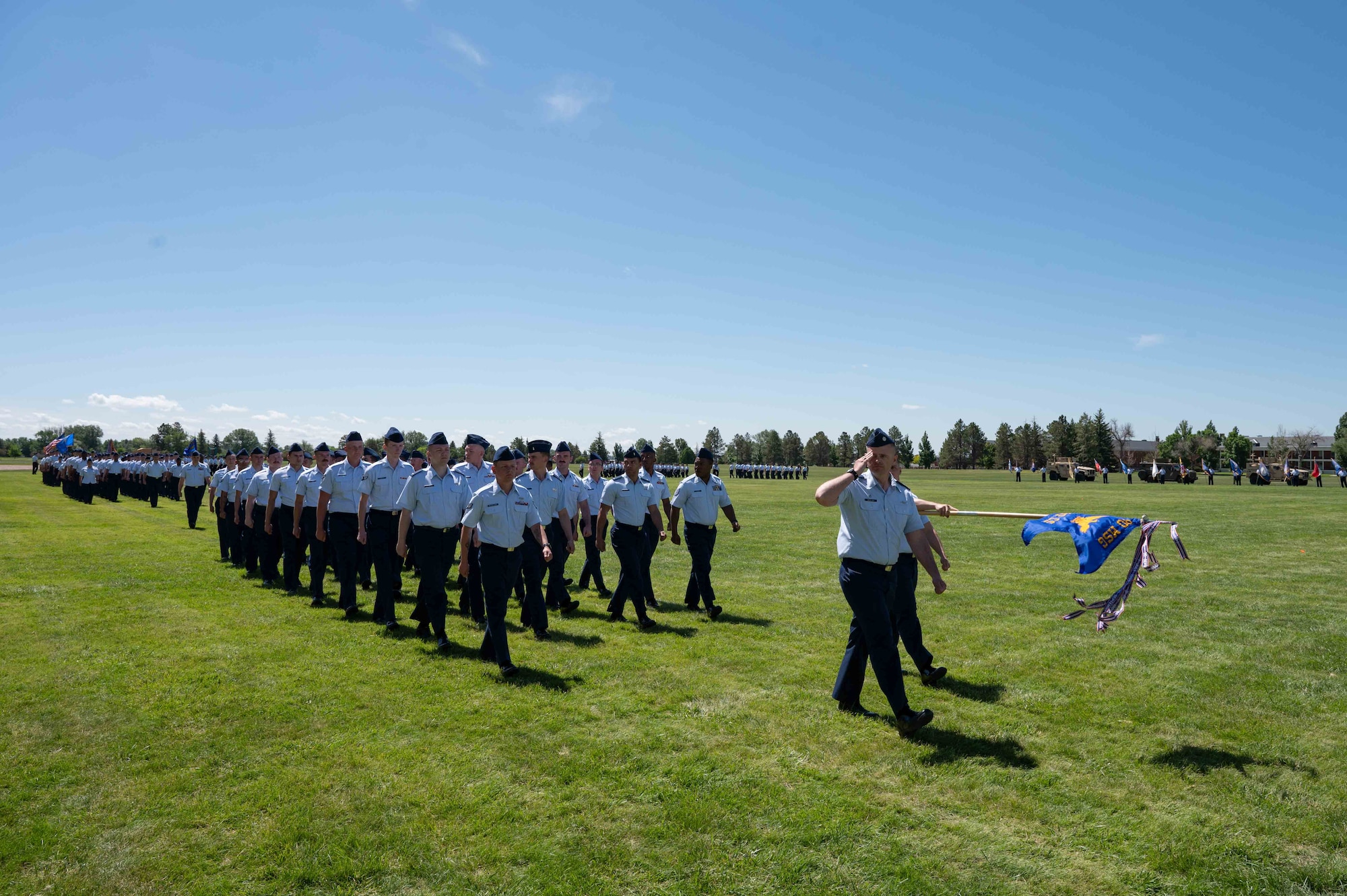 90 MW Airmen march in a change of command ceremony.