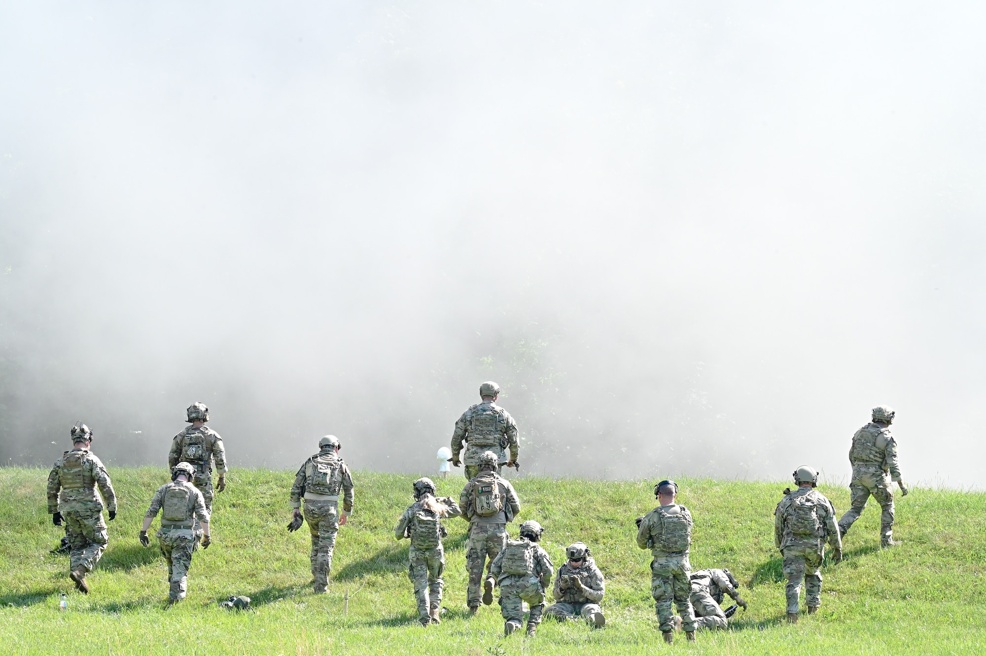 Integrated Defense Leadership Course cadre walk toward the detonation site of a spent claymore on June 1, 2023, at Camp James A. Garfield Joint Military Training Center, Ohio.