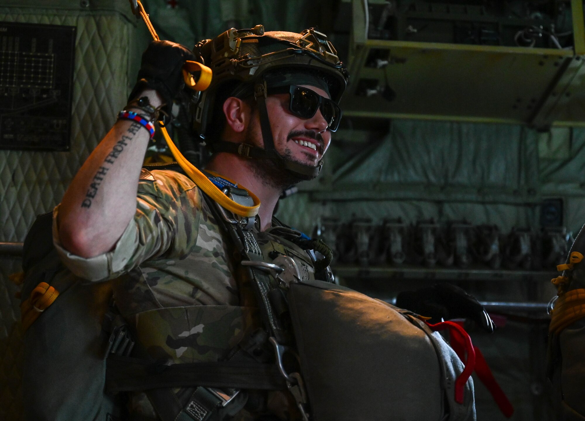 U.S. Air Force Staff Sgt. AJ Fossum, 824th Base Defense Squadron (BDS) fire team member, prepares to jump out of a 910th Airlift Wing C-130 Hercules, June 13, 2023, at Clinton Sherman Airport, Oklahoma. The BDS drop exercised security forces and 7th Air Support Operations Squadron (ASOS) Tactical Air Control Party (TACP) ability to remain agile in changing conditions in support of Exercise AGILE BLIZZARD-UNIFIED VISION. (U.S. Air Force photo by 2nd Lt. Mary Begy)