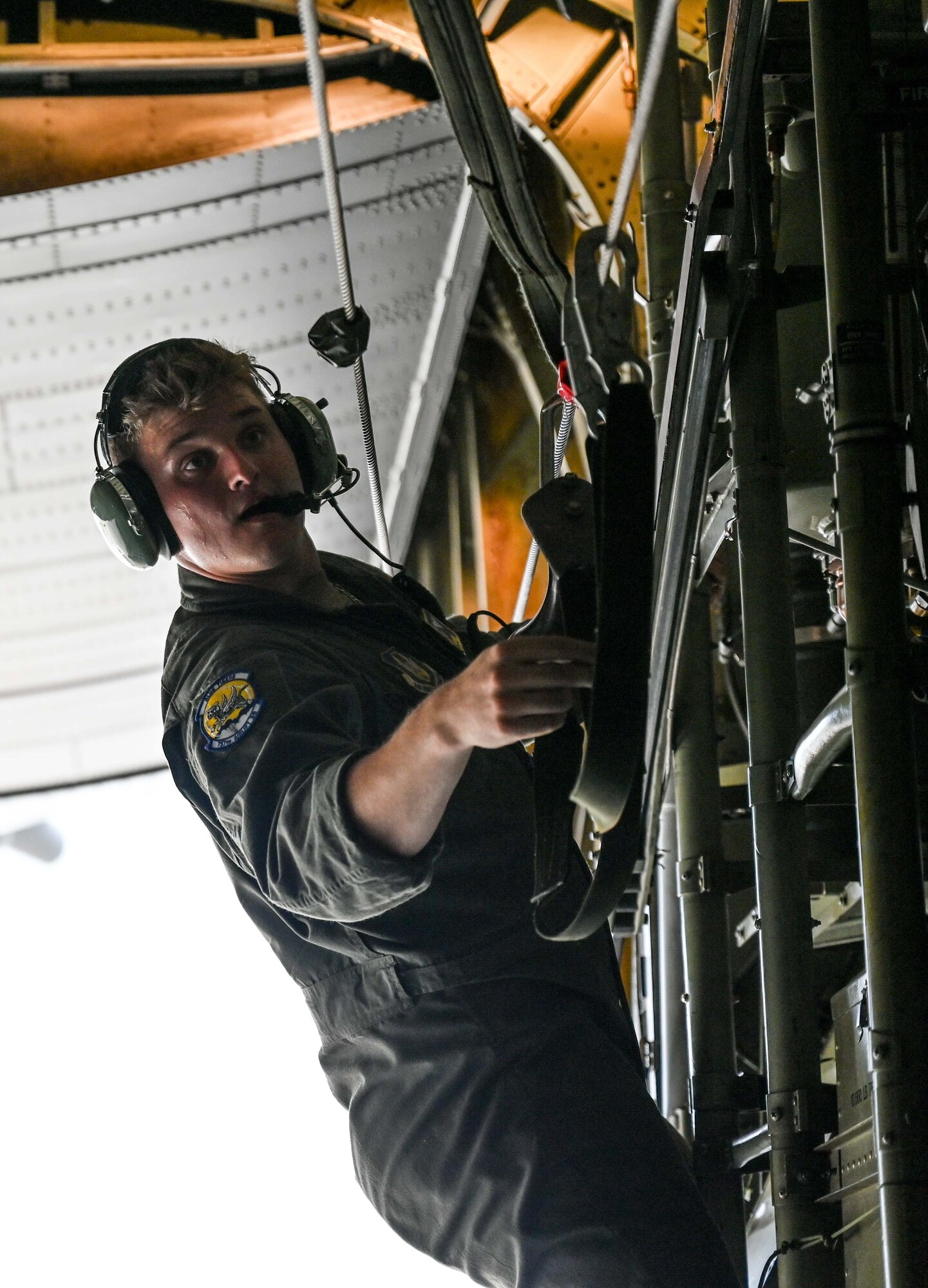 U.S. Air Force Staff Sgt. Gage Roth, 757th Airlift Squadron C-130 Hercules Loadmaster, prepares the aircraft for taxi, June 13, 2023, over Clinton Sherman Airport, Oklahoma. Roth was one of three loadmasters assisting in the 824th Base Defense Squadron drop out of the aircraft in support of Exercise AGILE BLIZZARD-UNIFIED VISION. (U.S. Air Force photo by 2nd Lt. Mary Begy)