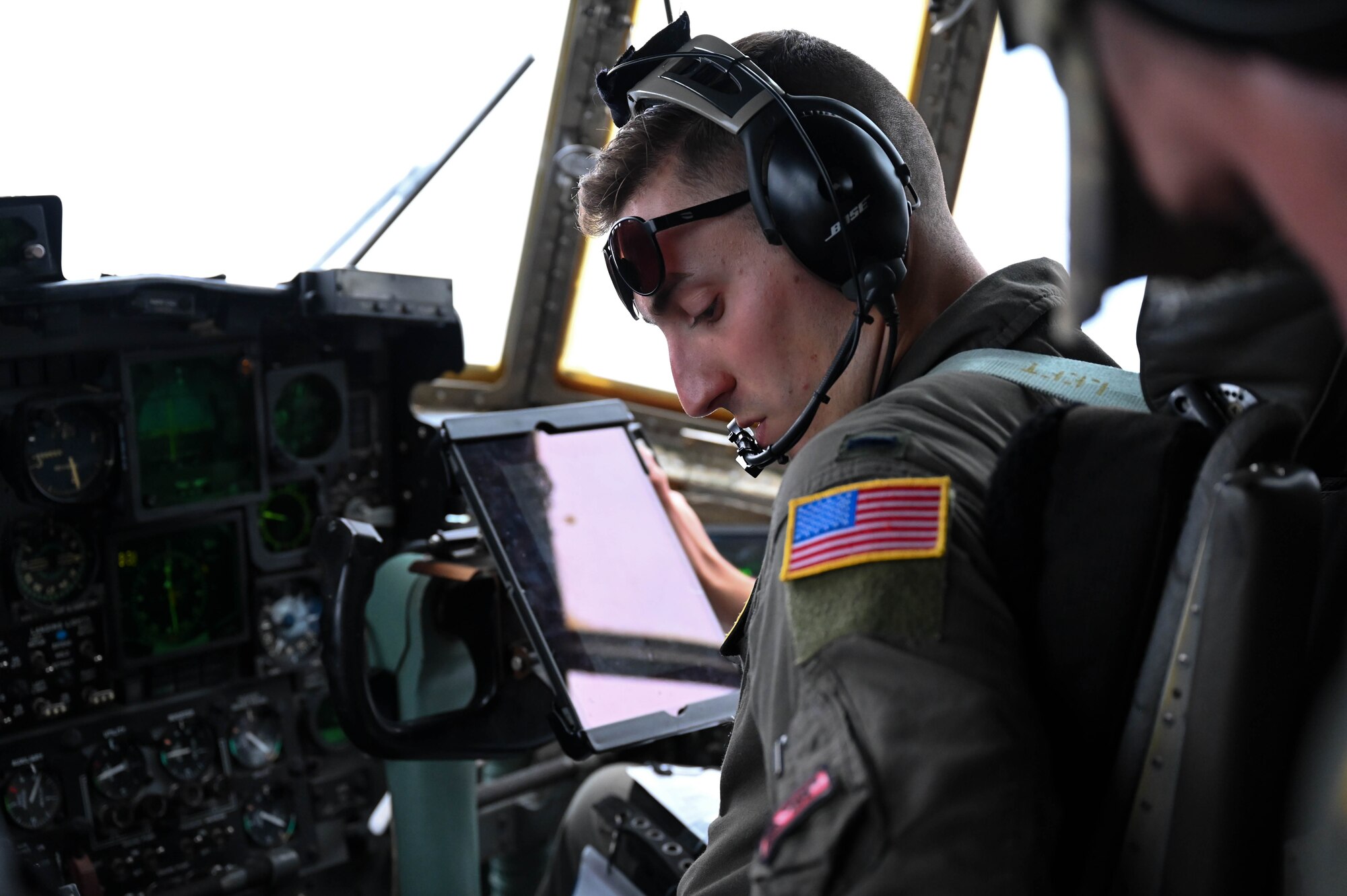 U.S. Air Force 1st Lt. Joe Lonardo, 757th Airlift Squadron C-130 Hercules copilot, checks systems before landing, June 13, 2023, at Tinker Air Force Base, Oklahoma. Lonardo was one of four aircrew members in the cockpit supporting several airlifts throughout Exercise AGILE BLIZZARD-UNIFIED VISION. (U.S. Air Force photo by 2nd Lt. Mary Begy)